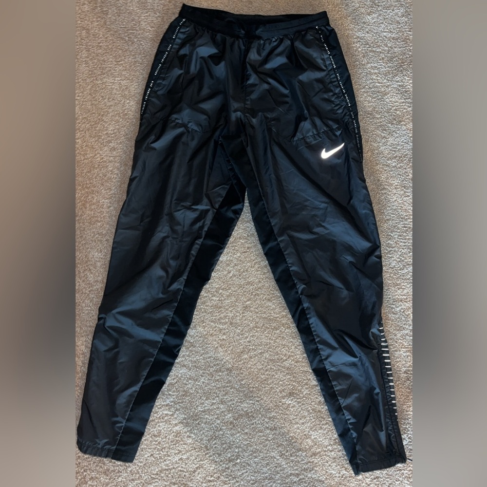 Black small Nike running pants, AMAZING quality. Zippers and reflective material